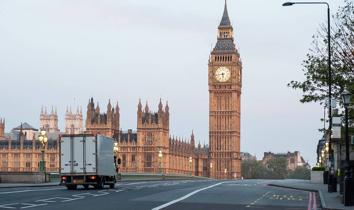 Delivery truck passing over Westminster Bridge, London